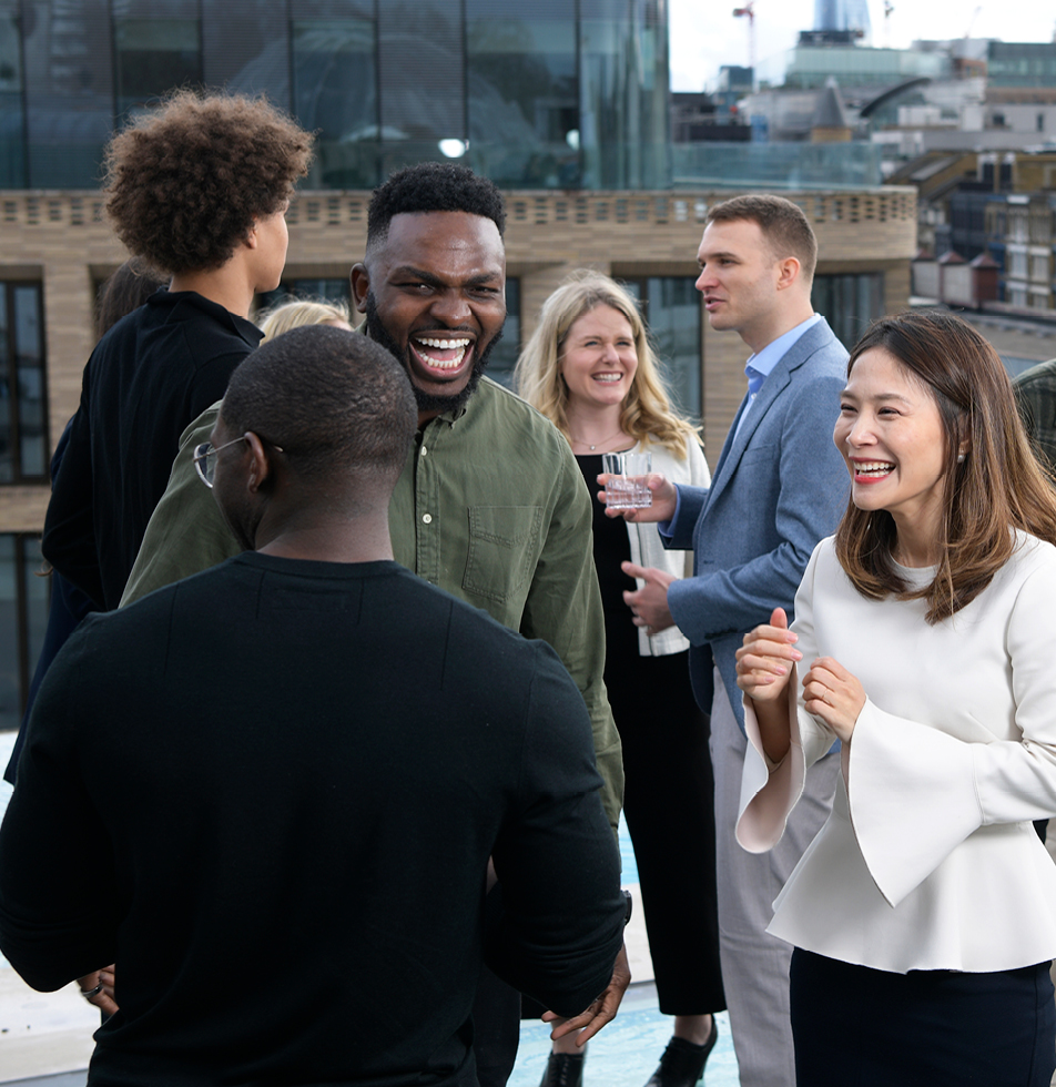 Group shot stood on a roof top